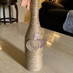 Hemp or ribbon wrapped bottles.